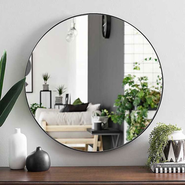 A rounded mirror reflect the situation inside a room