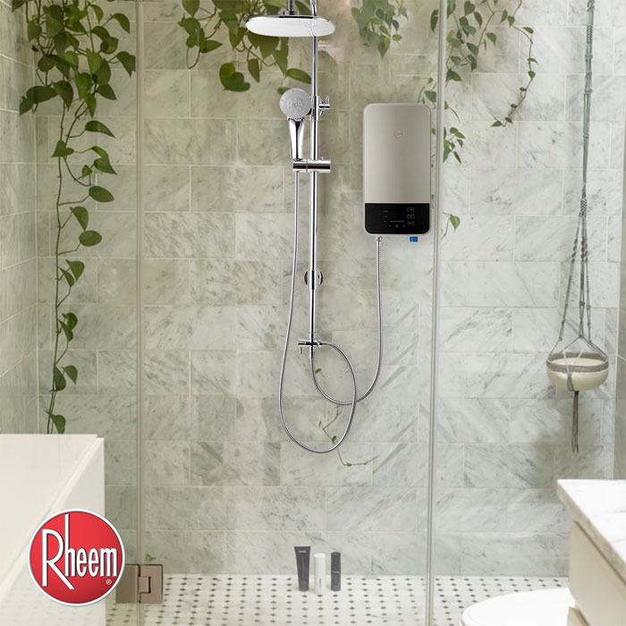 A tankless heater with rain shower mounted in a small bathroom