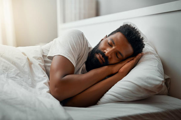 A man sleeping on bed