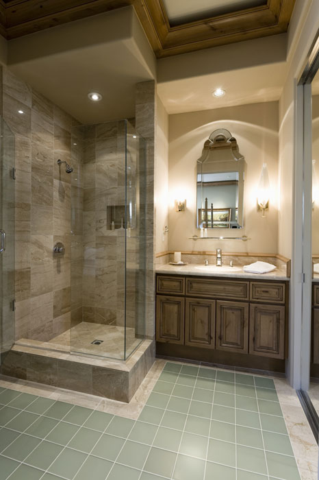 A bathroom with a mirror and 2 wall lamps