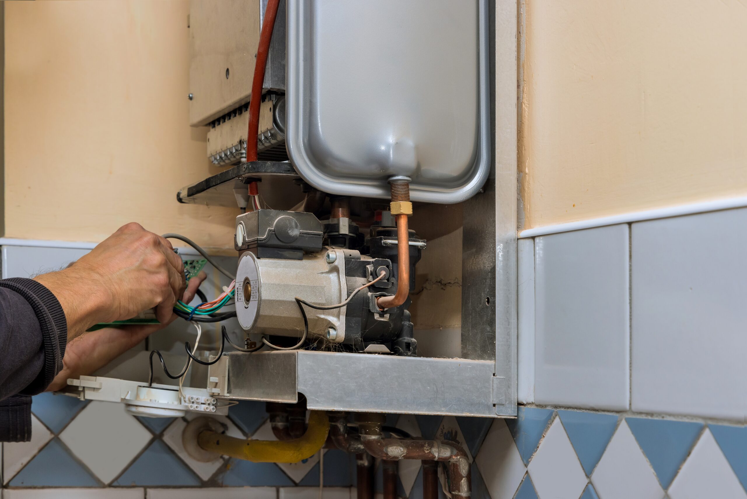 Water heater maintenance service technician repairing gas water heater-dawd124